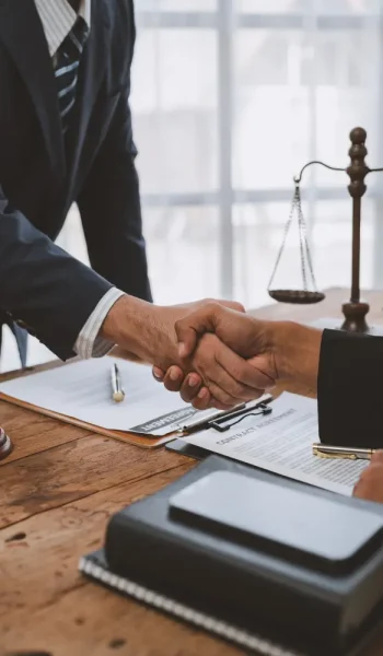 lawyers-join-hands-with-business-people-to-sign-a-2025-02-19-20-51-23-utc.webp